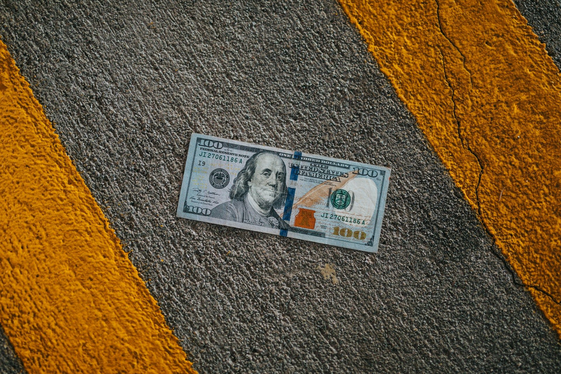 Money on the road representing the financial impact of relocating from California to Texas